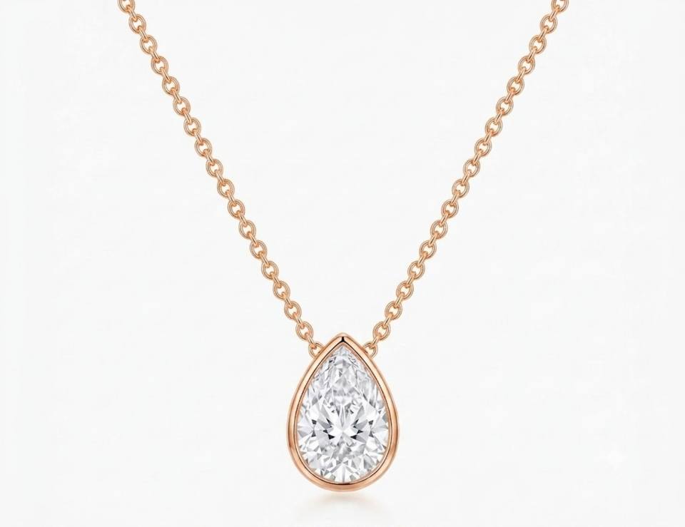 Lab grown diamond chain set with one Pear Shaped Diamond of 3 ct. Bezel Setting. 14K rose gold