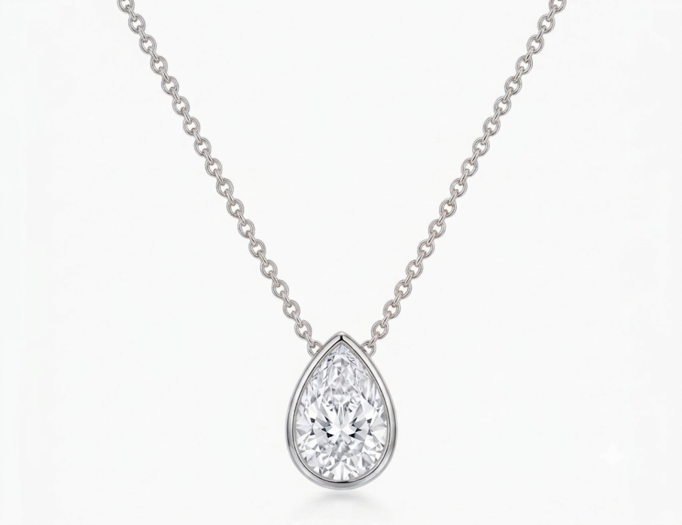 Lab grown diamond chain set with one Pear Shaped Diamond of 3 ct. Bezel Setting. 14K white gold